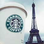 Starbucks coffee cup and Eiffel Tower.
