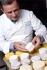 Roland Barthelemy inspects cheese...