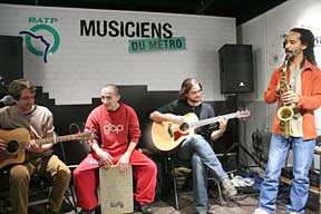 Licensed musicians playing in a Paris metro station.